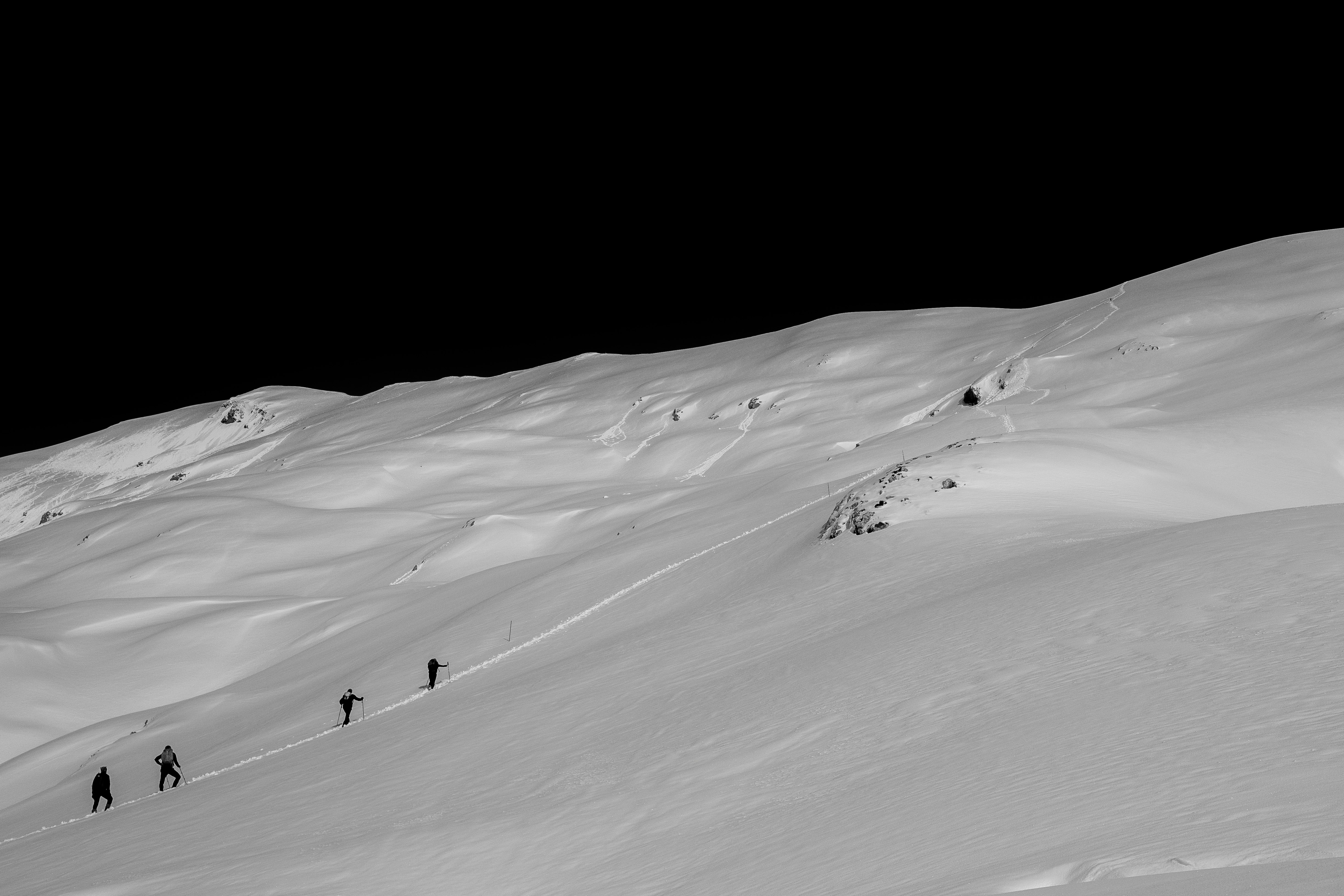 people standing on snow mountain during daytime